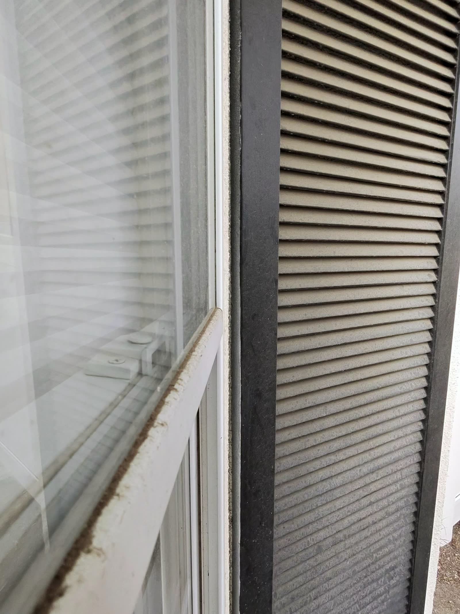 Grimy window glass before cleaning at a Hidden Hills home