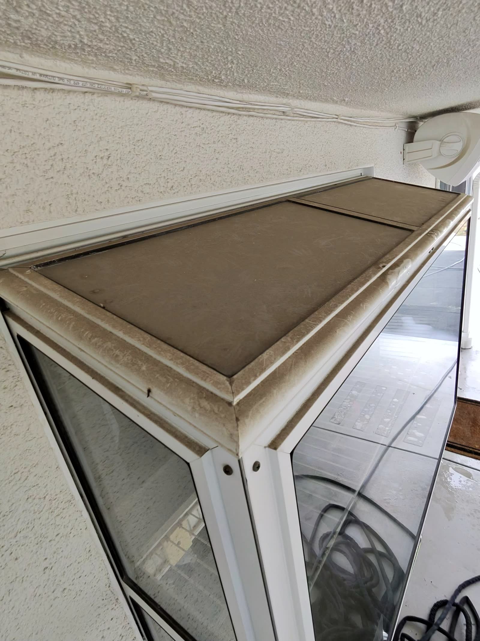 Dusty window before professional window cleaning in Tarzana