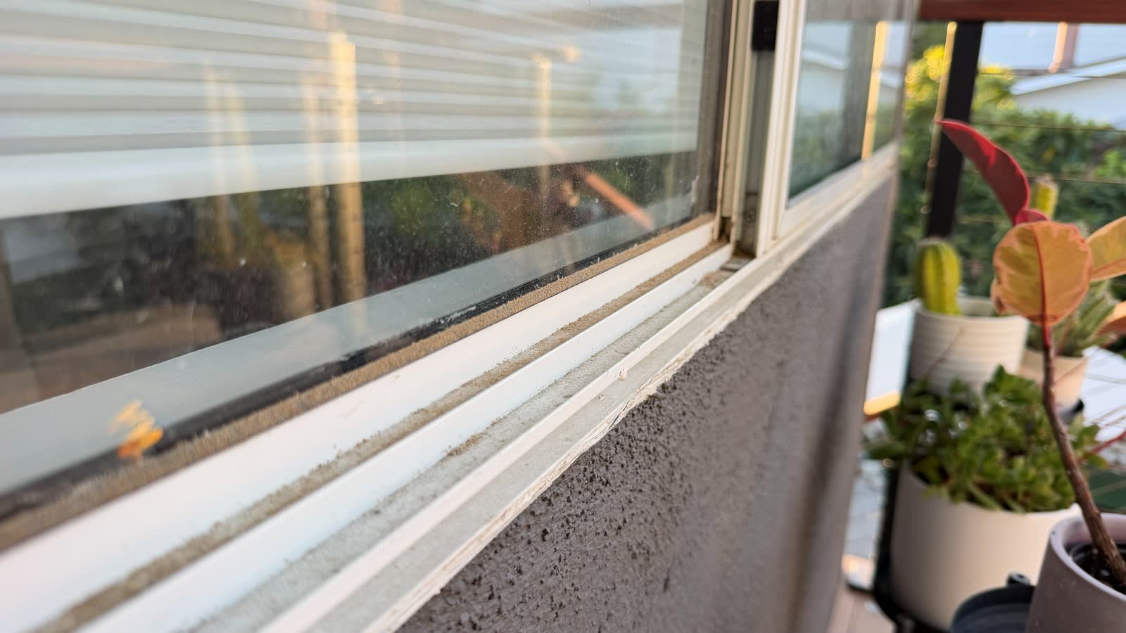 Dirty exterior window before professional window cleaning in West Hills