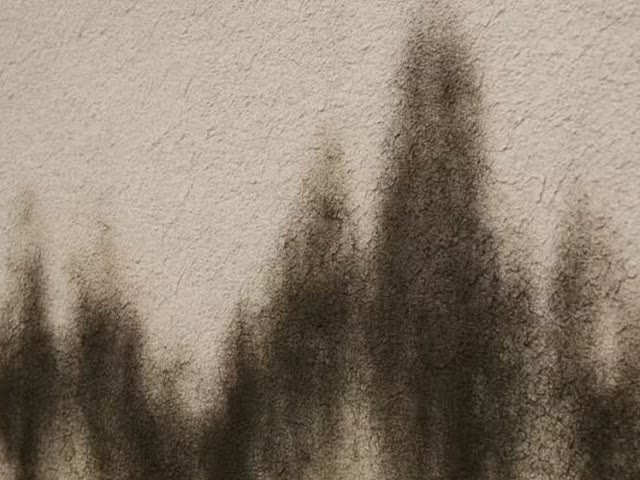 Water stains streaking down stucco