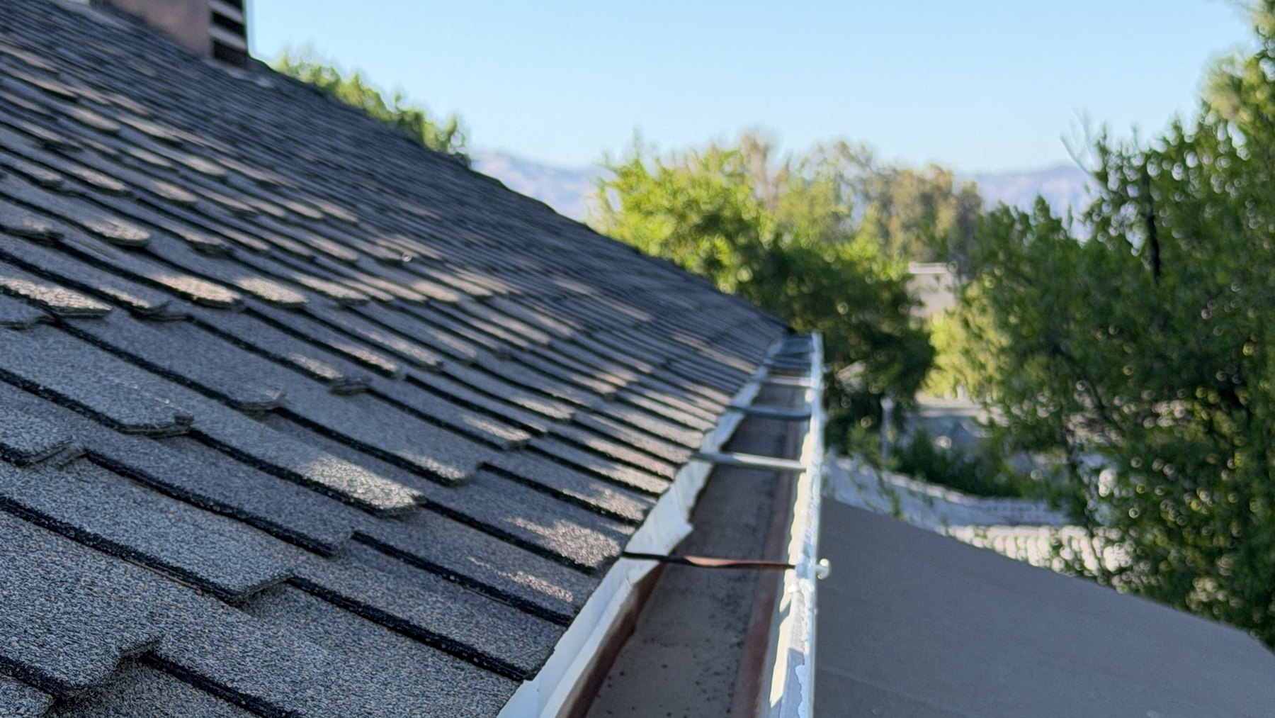 A Lucent-cleared gutter running clean along a Valley roofline