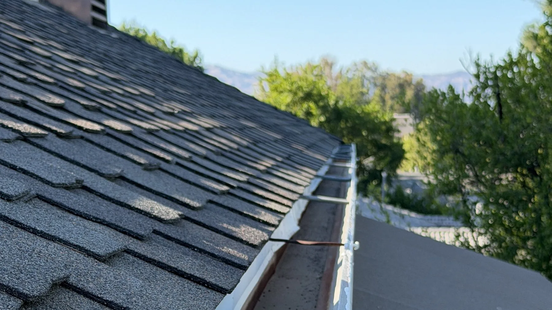 A Lucent-cleared gutter running clean along a Valley roofline